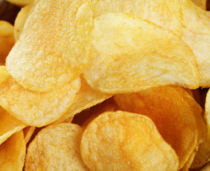 Potato chips fried a beautiful golden yellow hue.