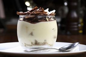 White dessert with chocolate flakes on top