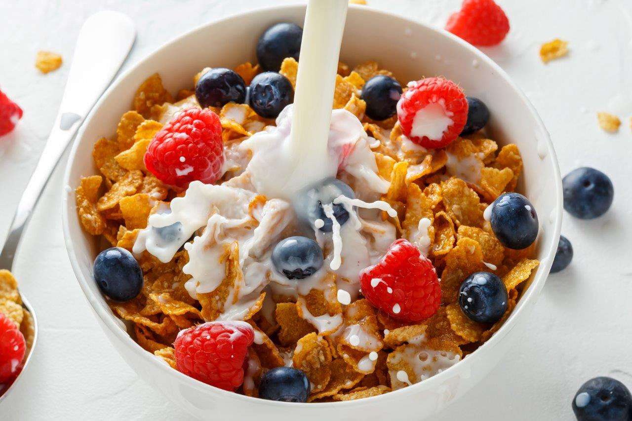 Extruded cereal and milk in a breakfast bowl