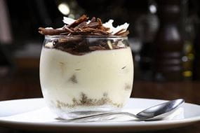 White dessert with chocolate flakes on top