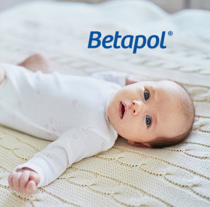 Baby lying on bed