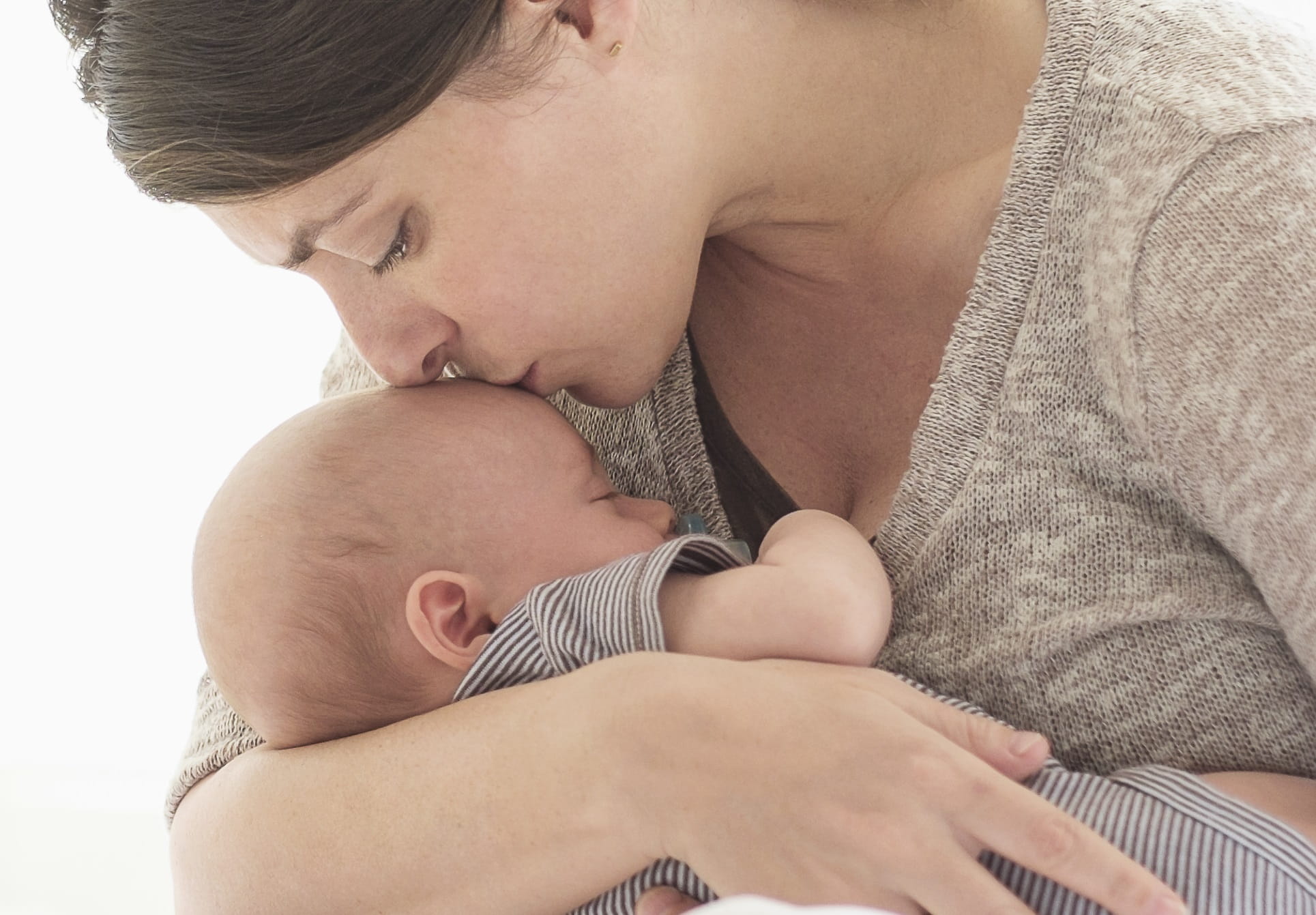 mum kissing baby